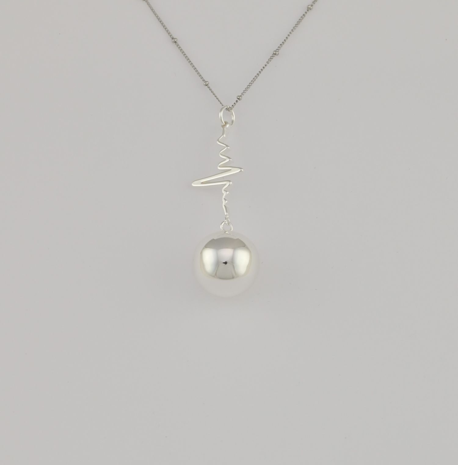 Bola de grossesse Spirales Argent – Bijou pour future maman avec chaîne